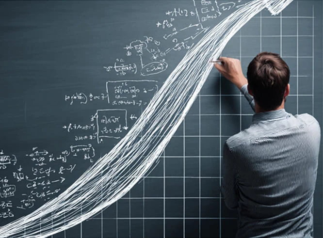 Person drawing growth lines on a glass board